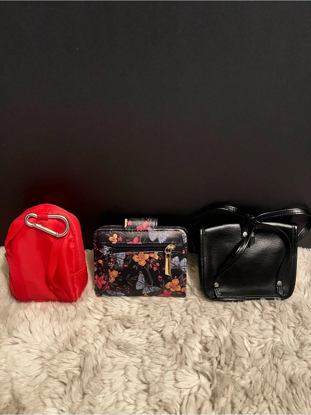 Three piece bundle of two coin, purses, and one small wallet